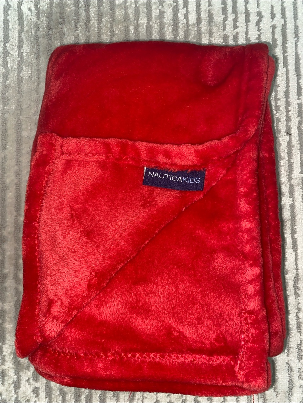 Nautica Kids Bright Red Fleece Throw. 40” x 50”